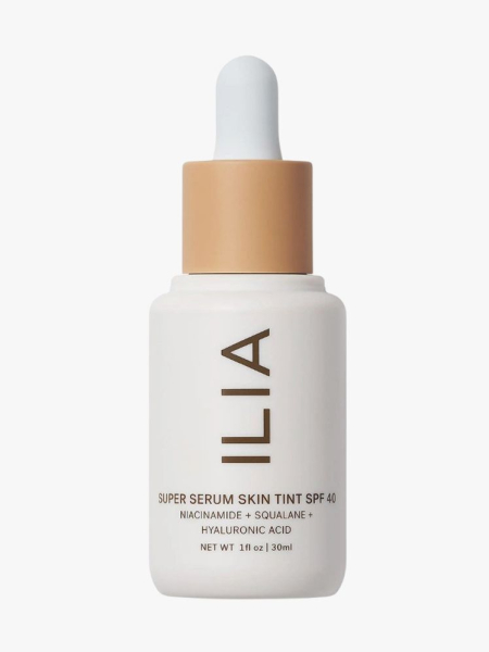 Super Serum Skin Tint SPF 40 off white bottle with beige and white top on light grey background